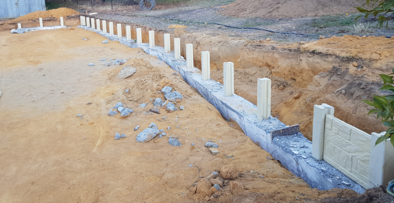 House retaining wall – pour and un-forming